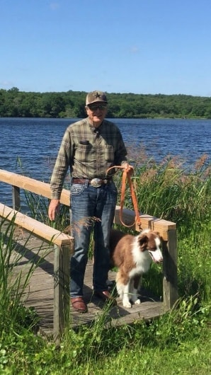 David Murdoch at the lake with his dog